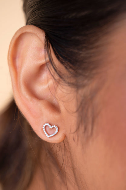 Enhance your style with our 18 kt Heart Basic Earring from the Spring Edit, priced under Rs. 30,000. Versatile from day to night, this exquisite jewelry piece makes a stunning addition to her collection and a thoughtful gifting idea. Shop now and add sophistication to any ensemble. 