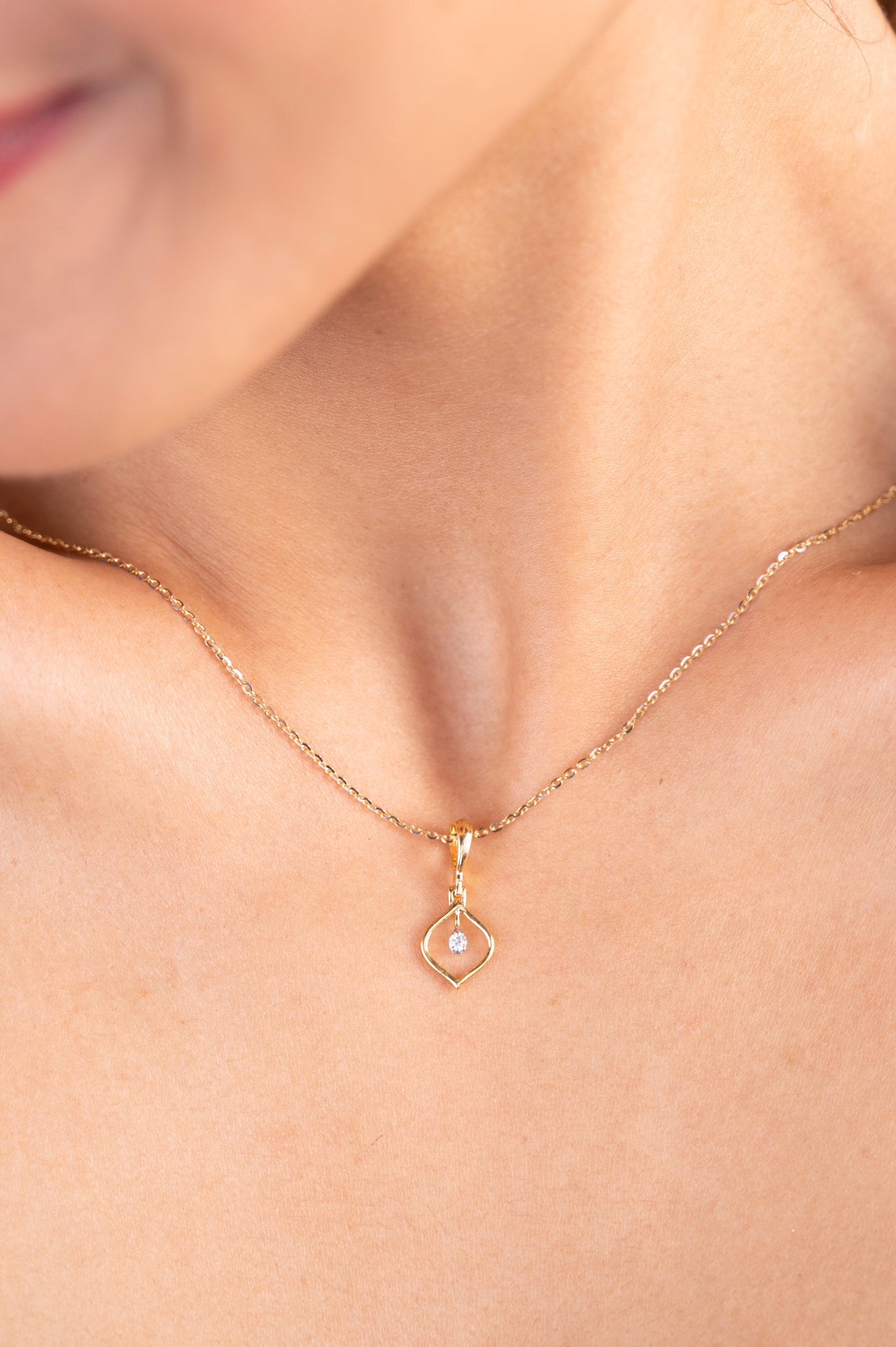 Enhance your everyday style with our charming 18kt gold Droplet Diamond Pendant. Discover timeless beauty with our Spring Diamond Bracelet, an exquisite piece priced under Rs. 10,000, perfect for everyday wear and thoughtful gifts. This minimalist pendant adds a delicate sparkle to any ensemble, whether it's casual wear, workwear, or special occasions. 