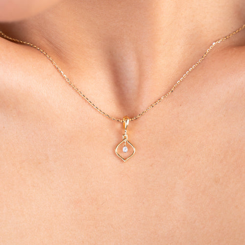 Enhance your everyday style with our charming 18kt gold Droplet Diamond Pendant. Discover timeless beauty with our Spring Diamond Bracelet, an exquisite piece priced under Rs. 10,000, perfect for everyday wear and thoughtful gifts. This minimalist pendant adds a delicate sparkle to any ensemble, whether it's casual wear, workwear, or special occasions. 