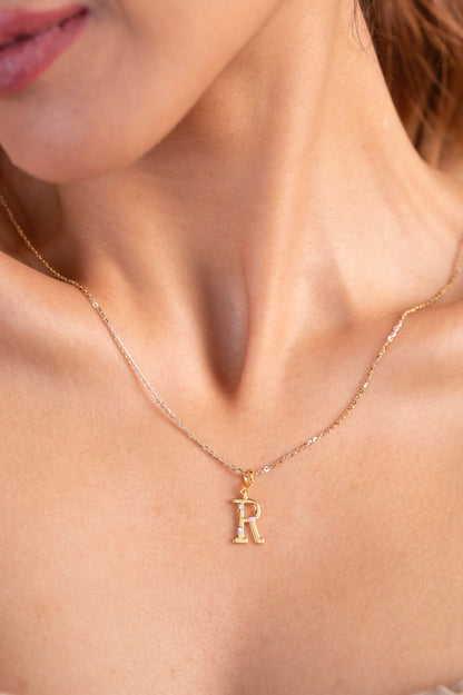 18kt gold Letter R Pendant with IGI-certified VVS diamonds, BIS hallmarking, and a lightweight design, perfect as personalized jewelry or everyday wear. From Caratly Jewelry under Rs. 15,000.