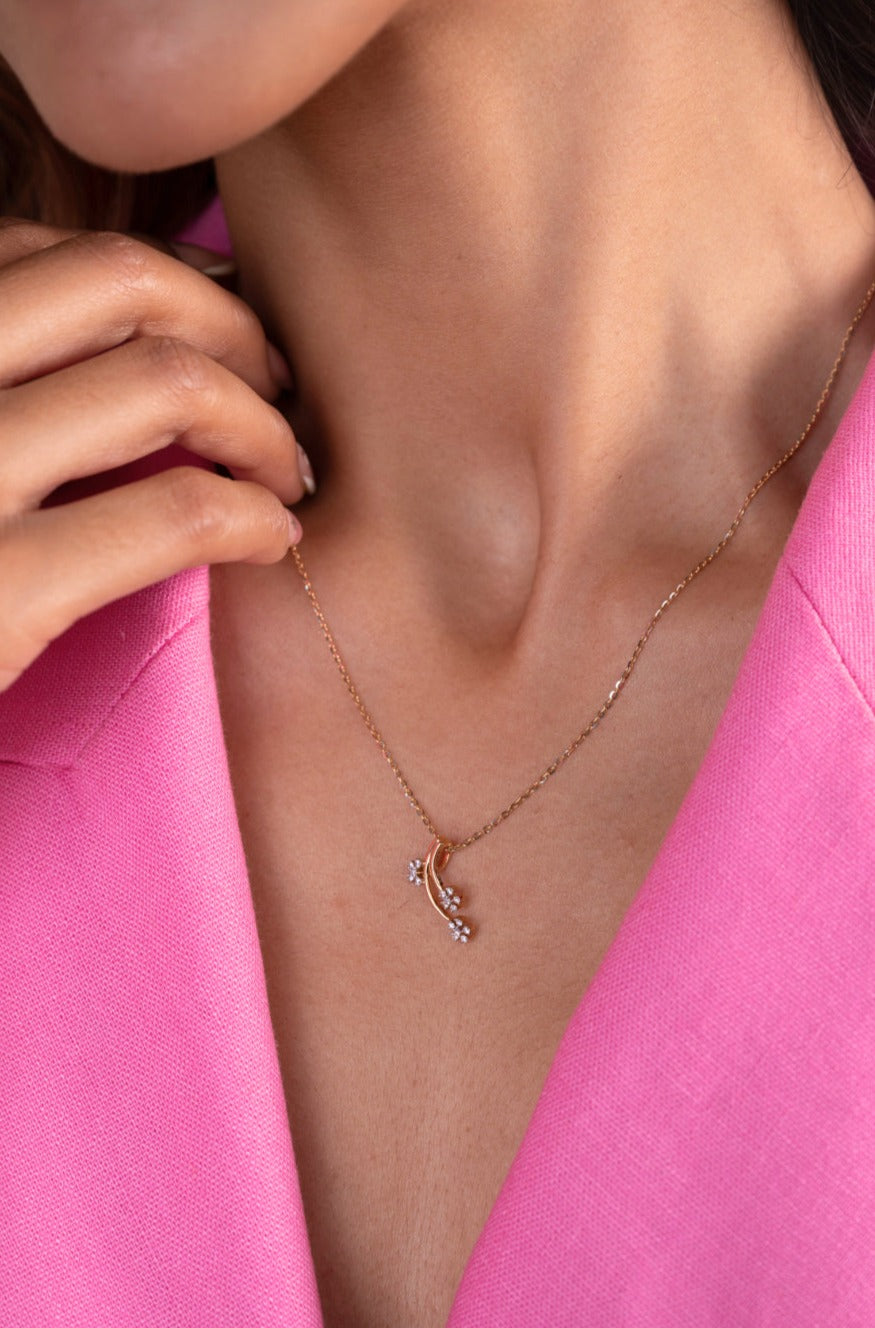 Indulge in elegance with our captivating 18kt gold Lily Diamond Pendant. This enchanting design blooms with a sparkling diamond, perfect for infusing everyday wear with a touch of femininity. Priced under 30,000, it's an ideal gift for her or a delightful treat for yourself.