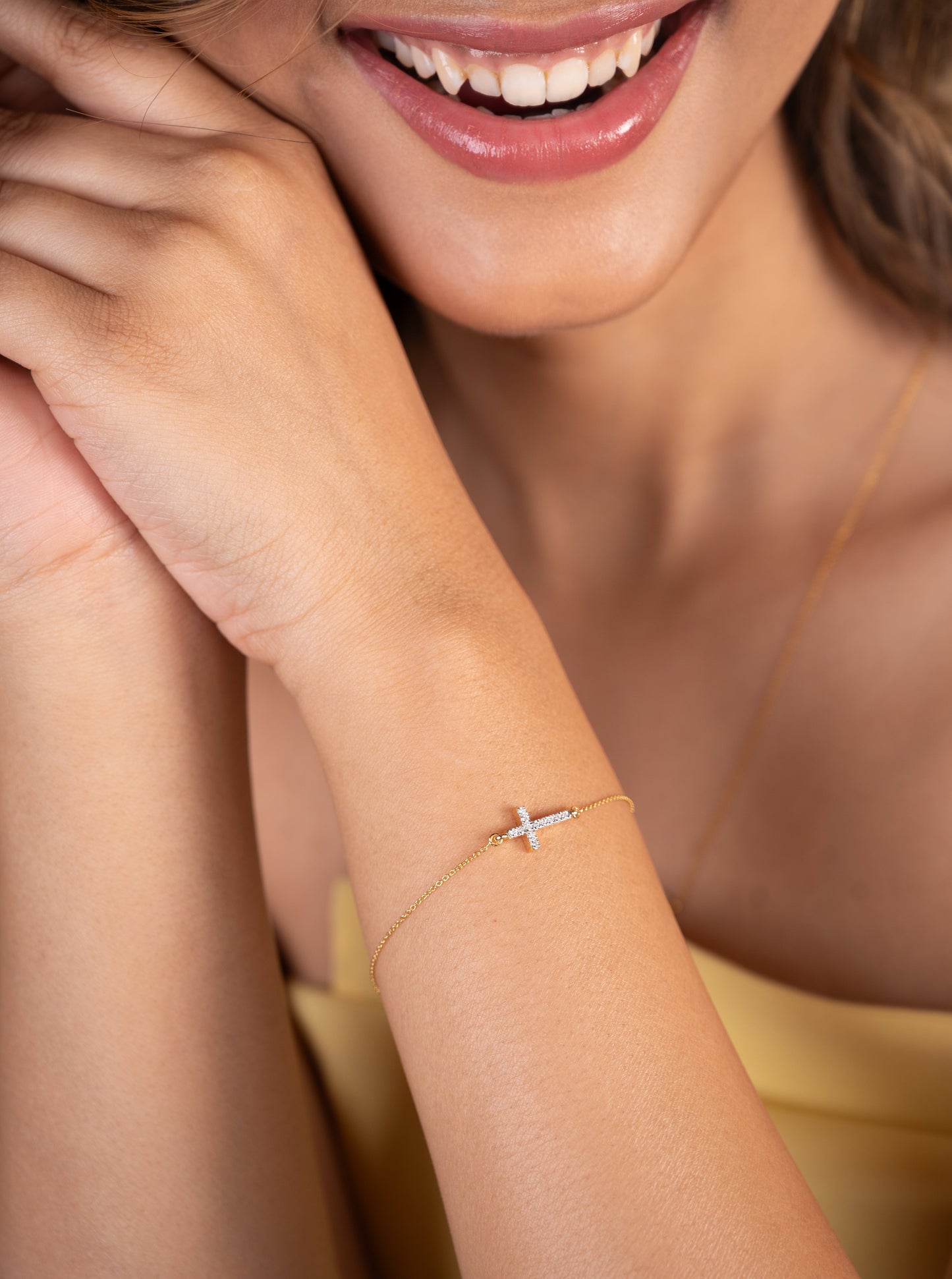 Elevate your style with this exquisite 18Kt gold bracelet featuring a delicate cross design adorned with sparkling diamonds. Crafted with exceptional attention to detail, this stunning piece effortlessly adds a touch of sophistication to any outfit, whether paired with casual or formal attire.