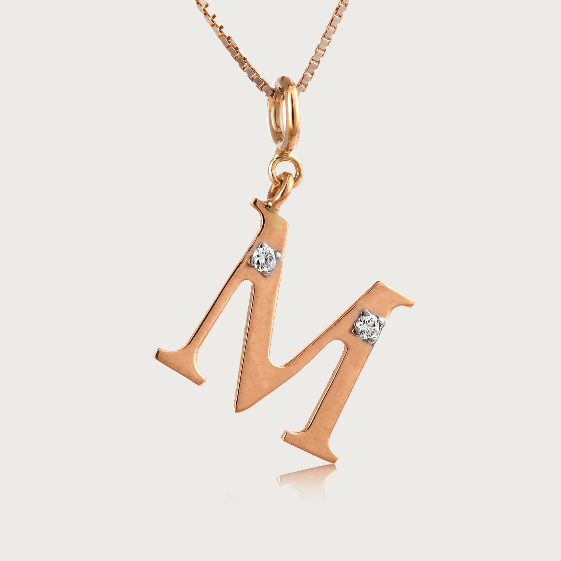 18kt gold "M" initial pendant with natural diamonds—luxury fine jewellery under ₹15,000.