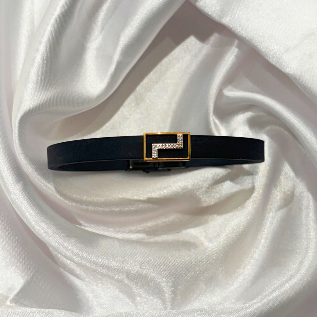 Zigzag-patterned men’s bracelet in 18kt gold with natural diamond, featuring a sleek black band—crafted for bold, everyday elegance under ₹30K.