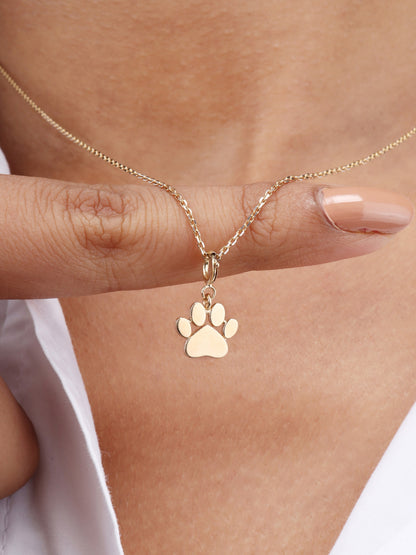 Caratly 18kt gold Paw Gold Pendant featuring a small, polished solid gold paw print charm on a delicate chain under Rs. 15,000