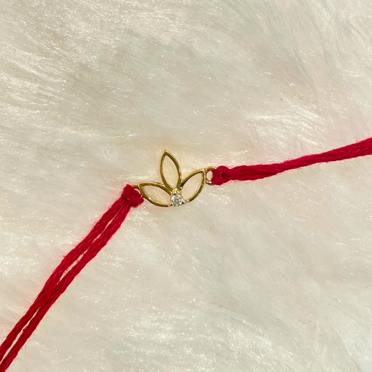 Leaflet Rakhi in 18kt gold with a natural diamond, tied on red thread—BIS hallmarked, perfect as a Rakhi cum pendant for Raksha Bandhan gifting under ₹15K for brother!