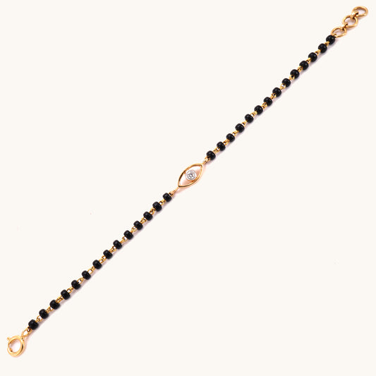 Diamond Evileye Mangalsutra Bracelet in 18kt gold, featuring IGI certified VVS diamonds under Rs. 25k. Luxury jewelry for women from Caratly, ideal for gifts and special occasions.