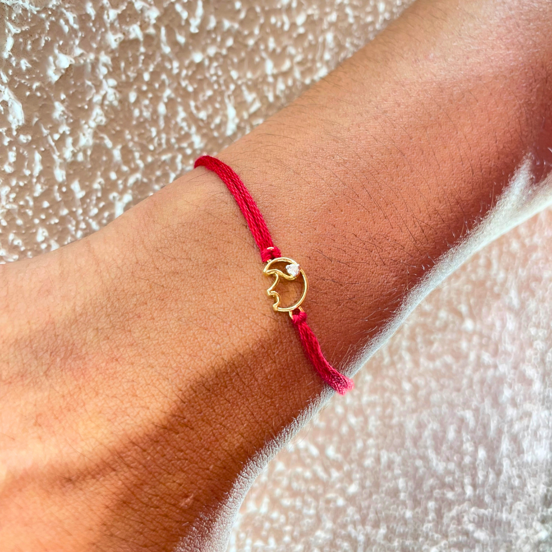 Elephant Rakhi in 18kt gold with a natural diamond, tied on red thread—BIS hallmarked, a Rakhi cum pendant symbolizing strength, wisdom & love under Rs. 15,000! 
