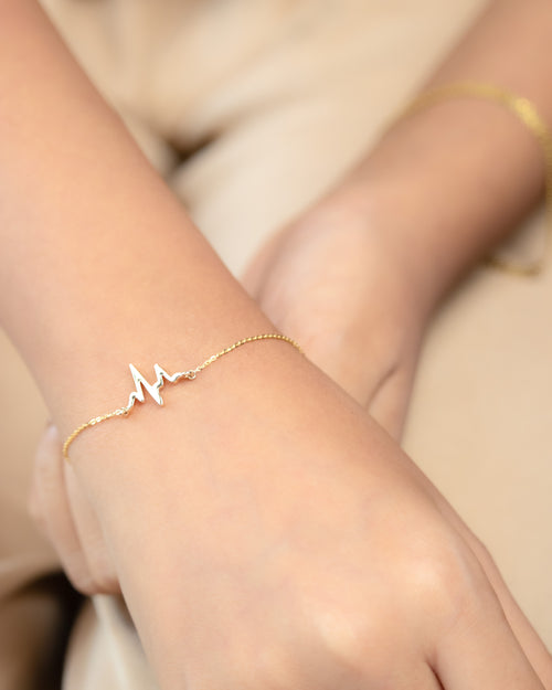 Heartbeat Gold Bracelet in 18kt gold, IGI-certified and BIS-hallmarked, from Caratly Luxury Jewels. Perfect for everyday wear and gifting under Rs. 15,000.