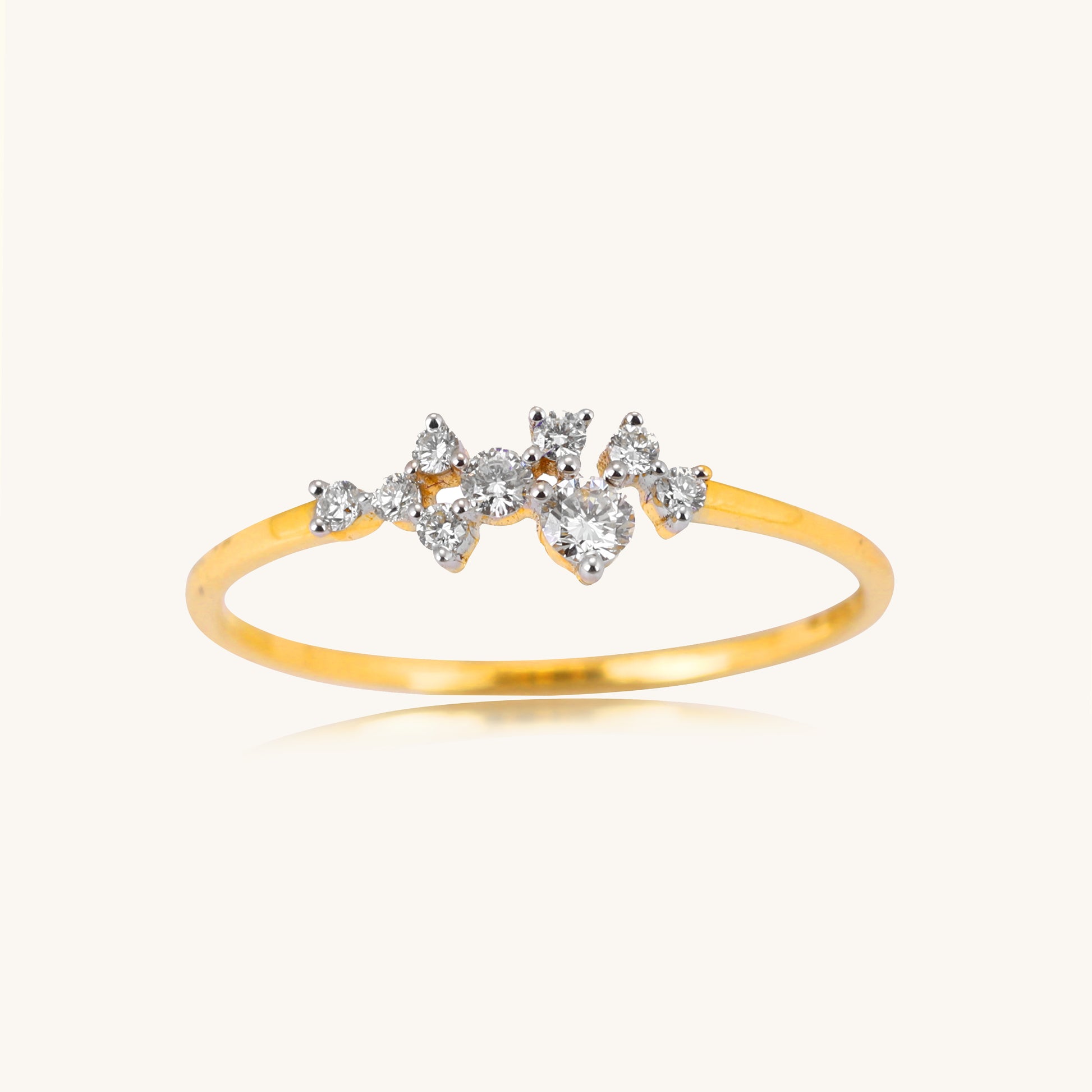 Elevate your look with our stunning 18kt gold ring, adorned with a delicate cluster of sparkling diamonds. Whether for everyday wear or special occasions, this ornate design exudes timeless elegance, adding a touch of sophistication to any outfit. Priced under Rs. 30,000, it makes a thoughtful gifting idea for her. Effortlessly transition from work to weekend with this versatile piece.