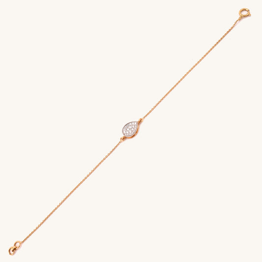 Indulge in affordable luxury with our 18kt gold Teardrop Diamond Bracelet. This exquisite piece from our Spring Edit Collection adds a touch of glamour to any outfit, elevating your everyday elegance. A must-have accessory for the fashion-conscious, all under Rs. 30,000.