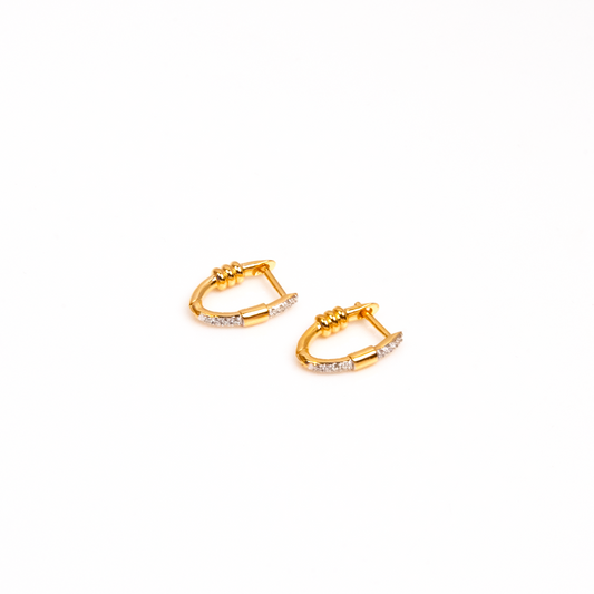 Elevate your style with these 18kt gold hoop diamond earrings. Designed for daily wear, these versatile earrings effortlessly complement any outfit, making them perfect for everyday use. A thoughtful gift idea for her, this affordable collection adds a touch of luxury to any occasion. Enhance your 9 to 5 look with these under 30,000 collections, a must-have for your workwear edit.