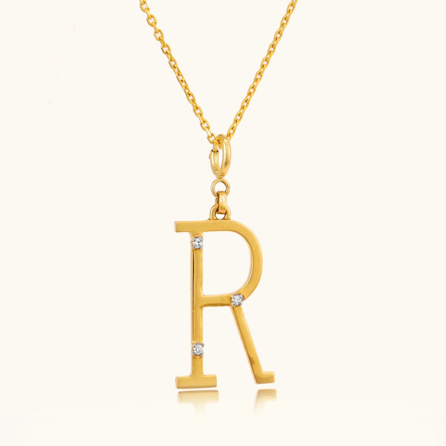 18kt gold Letter R Pendant with IGI-certified VVS diamonds, BIS hallmarking, and a lightweight design, perfect as personalized jewelry or everyday wear. From Caratly Jewelry under Rs. 15,000.