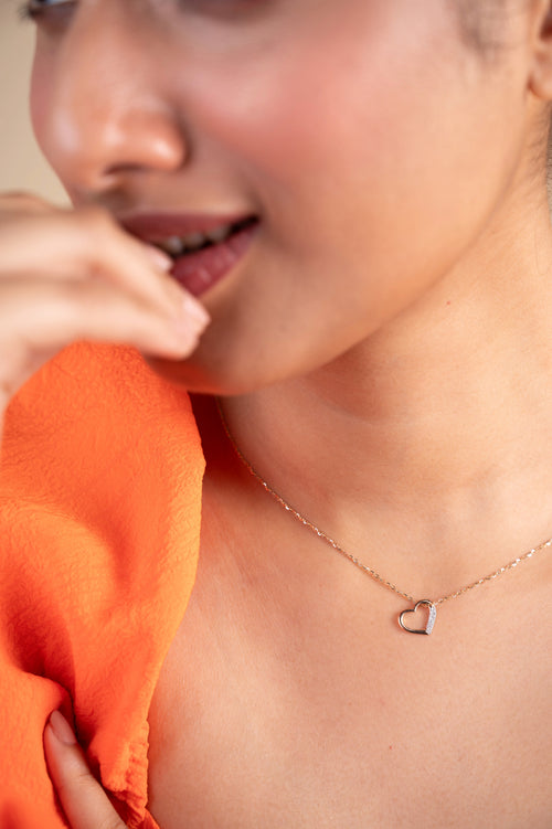 Heart-shaped pendant in 18kt gold with a sparkling IGI-certified diamond, ideal for affordable diamond jewelry or everyday wear under ₹15,000.