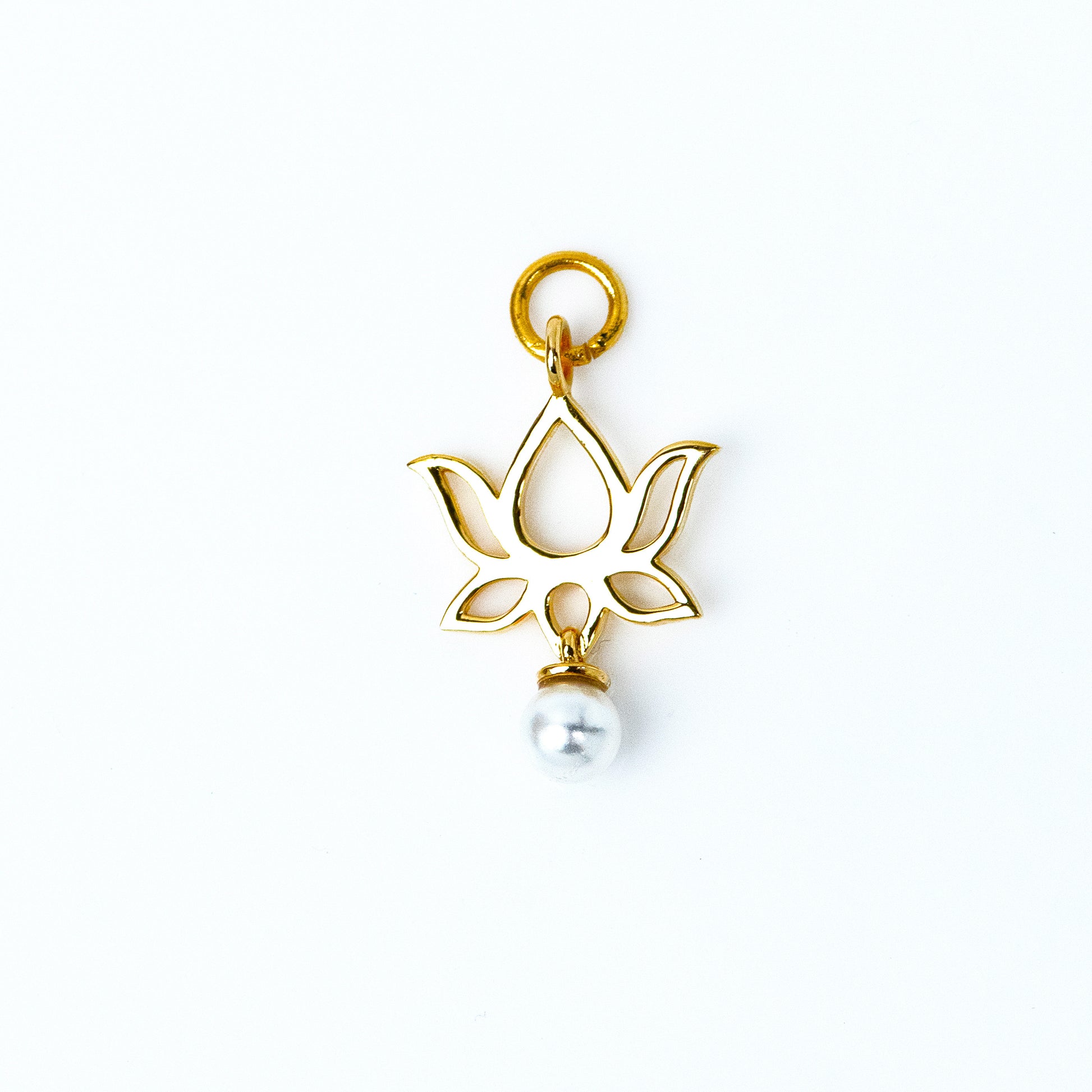 Lotus Gold Charm, a symbol of purity and beauty crafted from 18kt gold for women. Explore our affordable collection for gifting ideas under 10,000 and discover the perfect addition to your 9 to 5 workwear edit jewellery collection. 