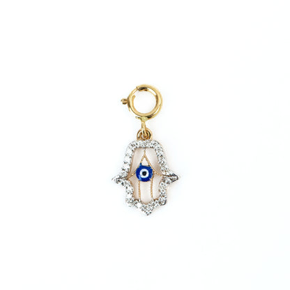 Capture timeless elegance with our Evil Eye Charm crafted in 18kt gold. Perfect for daily wear for women. Elevate your 9 to 5 outfit with our affordable collection, curated for the modern woman. Luxury gifting ideas under 30,000 collections. Embrace style and protection with our Evil Eye Charm.