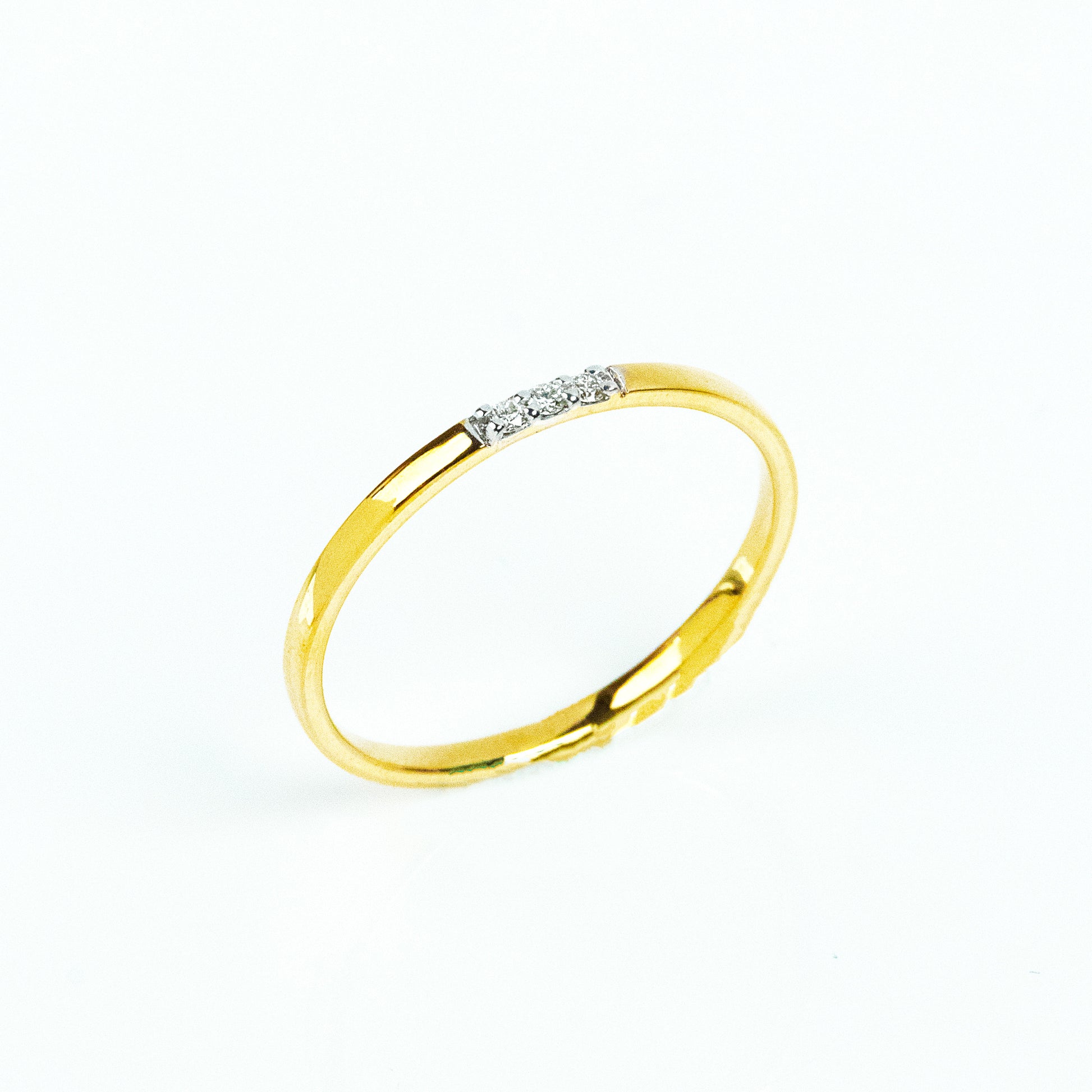  3 Diamond Ring crafted in 18kt gold. It effortlessly transitions from 9 to 5 to after-hours events. Whether it's a thoughtful gift for her or a chic addition to your own collection, this versatile diamond ring exudes understated luxury. Explore our affordable under 10,000 collections and elevate your style with ease. 