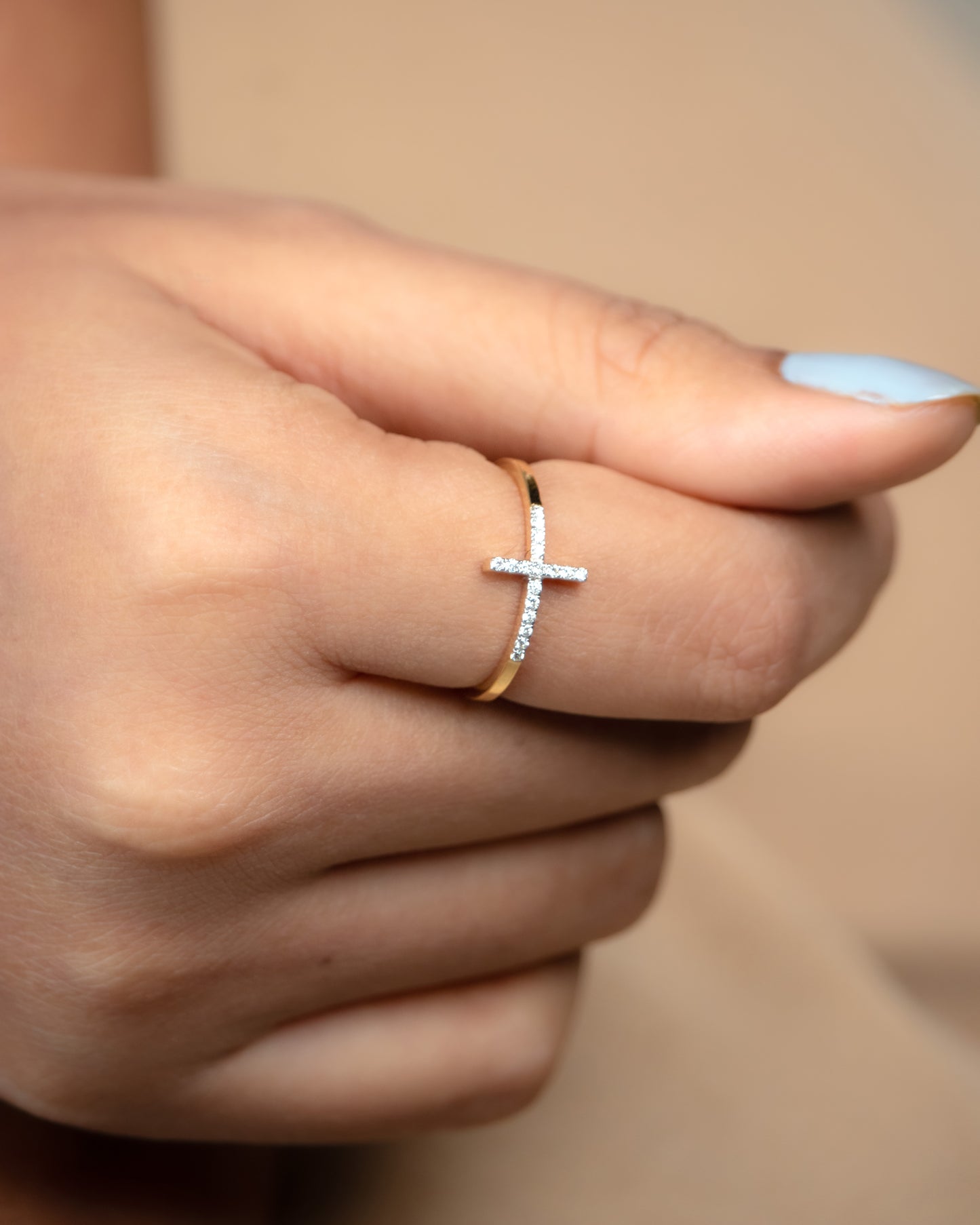 Crafted from luxurious 18kt gold, this exquisite cross diamond ring is designed for daily elegance. Elevate your workwear edit with this affordable yet stunning piece from our under 30,000 collections. Whether for yourself or as a thoughtful gift for her, this versatile jewellery ring exudes sophistication and style. 