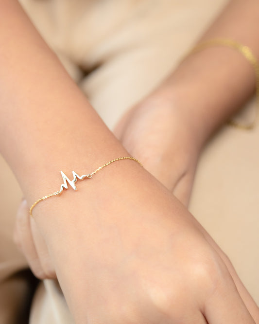 Celebrate life and love with our Heartbeat Gold Bracelet crafted from 18kt gold. Jewellery piece for everyday wear for women. Gift it to her as a reminder of your affection. A perfect addition of jewellery piece to your work wear edit priced under Rs. 30,000.