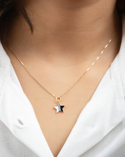 Add a touch of celestial elegance to your everyday wear with our 18kt Gold B&W Star Charm. This versatile piece is ideal for daily wear for Women. An affordable gifting option for her under 10,000.