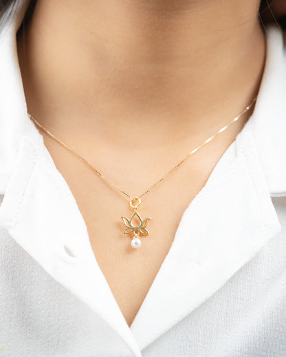 Lotus Gold Charm, a symbol of purity and beauty crafted from 18kt gold for women. Explore our affordable collection for gifting ideas under 10,000 and discover the perfect addition to your 9 to 5 workwear edit jewellery collection. 