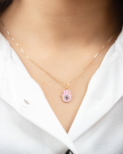  Pink Hamsa Charm crafted with 18kt gold. It's perfect for daily wear, symbolizing protection and good fortune. Explore our affordable collection for gifting ideas under 30,000, and discover the perfect addition to your 9 to 5 workwear edit.