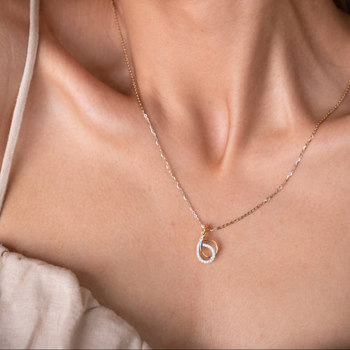 Elevate your style with our 18kt Interloop Diamond Pendant from the Spring Edit. Designed to dazzle, this exquisite piece adds a modern flair to your everyday ensemble. Affordable luxury under 30,000, it's a must-have addition to your fine jewelry collection. Discover timeless beauty with our Spring Diamond Bracelet from the spring edit collection, priced under Rs. 30,000. 