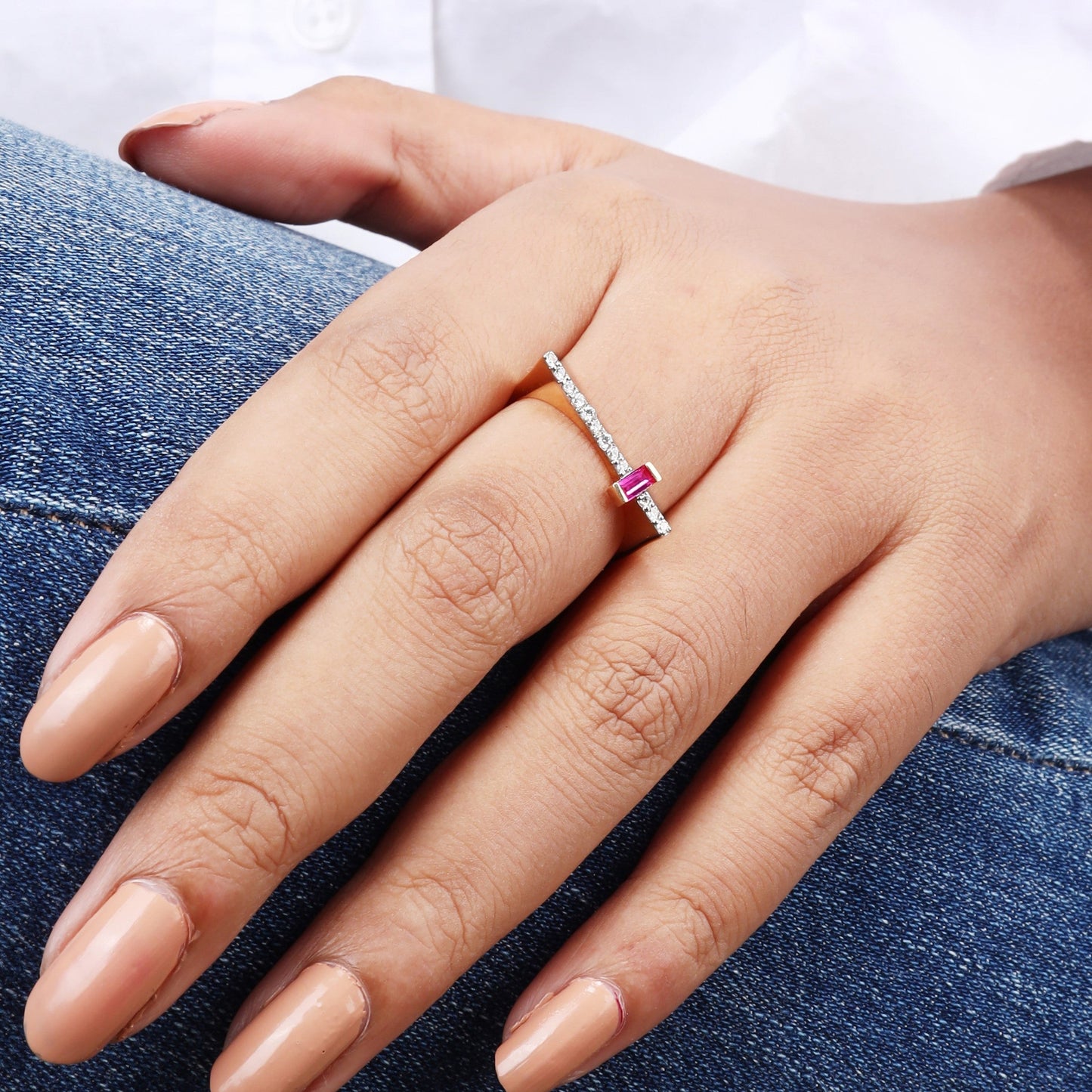 Caratly 18kt gold Elegant Red Ring featuring a modern asymmetrical design with a horizontal diamond pave bar meeting a vertical baguette-cut red gemstone