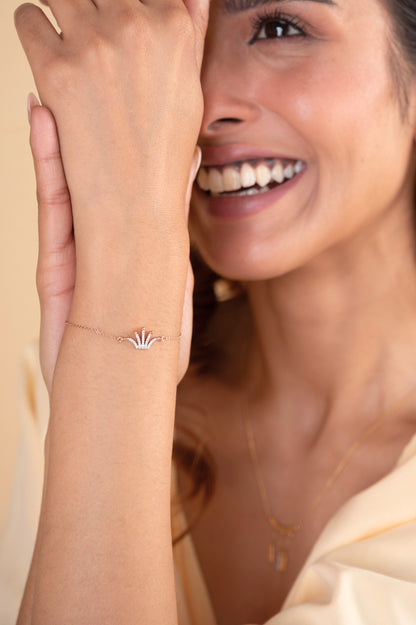 Elevate your style with our 18kt Diamond Crown Bracelet - the ultimate work-to-evening accessory. Crafted with luxurious materials, this bracelet adds a touch of glamour to both professional and casual outfits. An exceptional gift idea for the modern woman, priced under Rs. 30,000 in our exclusive spring collection.