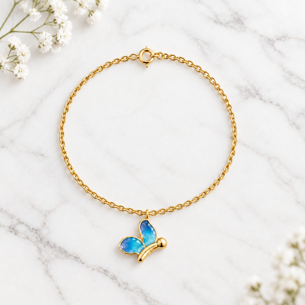 Gold chain bracelet with an enamel blue butterfly charm dangling priced under Rs. 30,000.