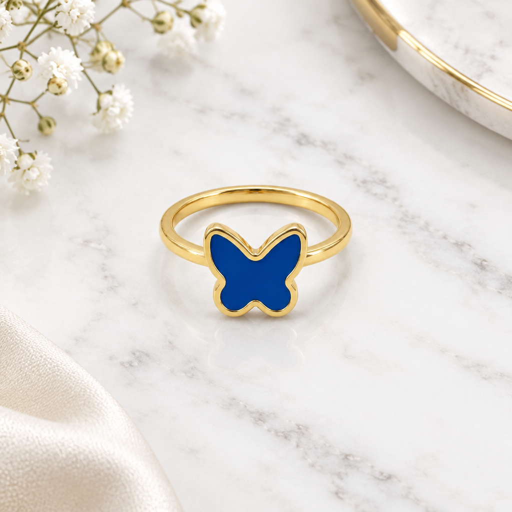 Gold ring with a solid blue enamel butterfly top. Minimal and cute gifts under Rs. 20,000