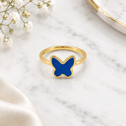 Gold ring with a solid blue enamel butterfly top. Minimal and cute gifts under Rs. 20,000