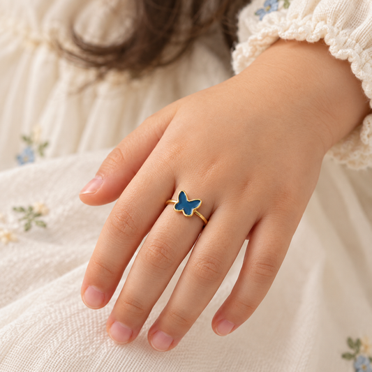 Gold ring with a solid blue enamel butterfly top. Minimal and cute gifts under Rs. 20,000