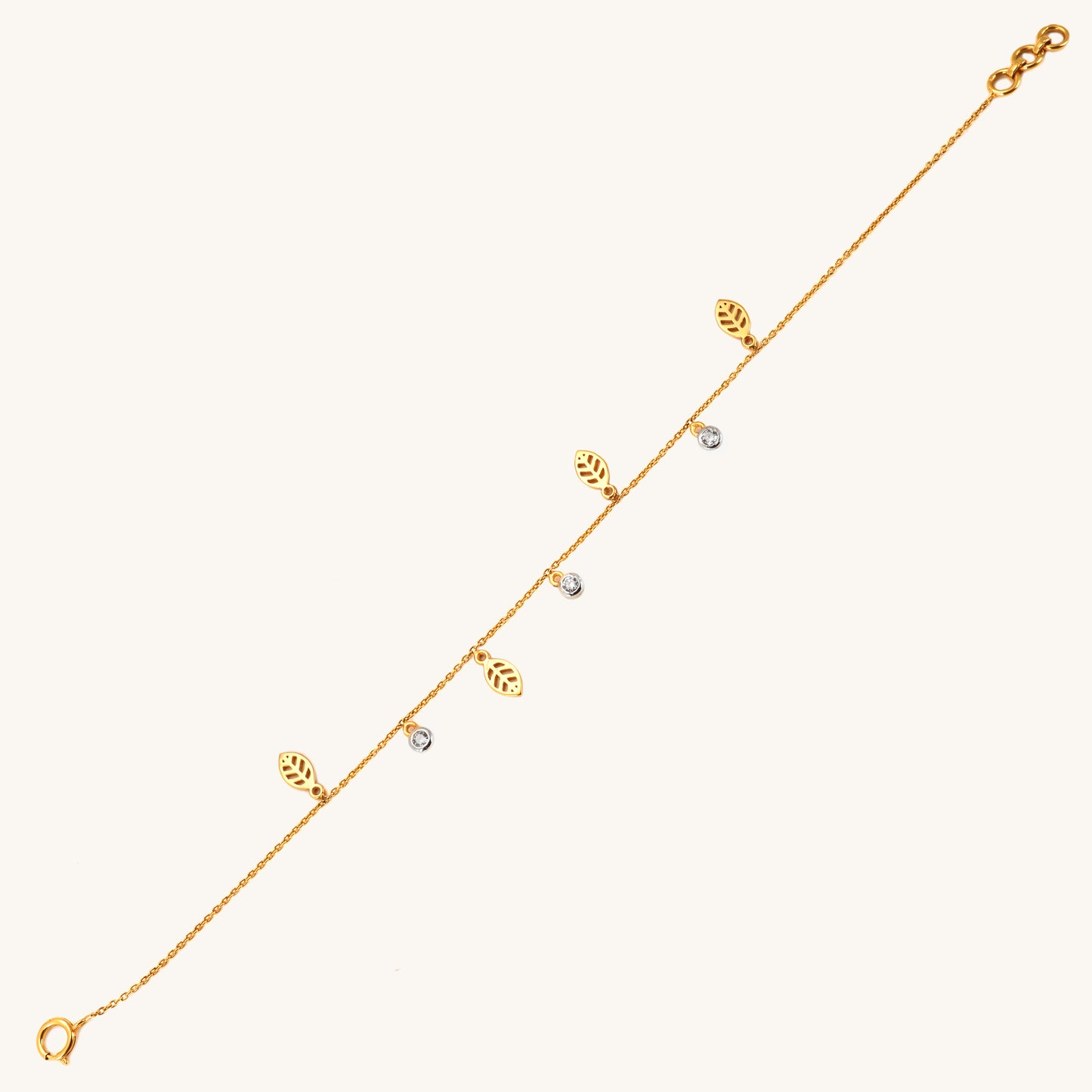 Caratly 18kt gold Leaf Diamond Bracelet featuring a delicate chain with alternating dangling open gold leaf charms and round diamond accents under Rs. 40,000