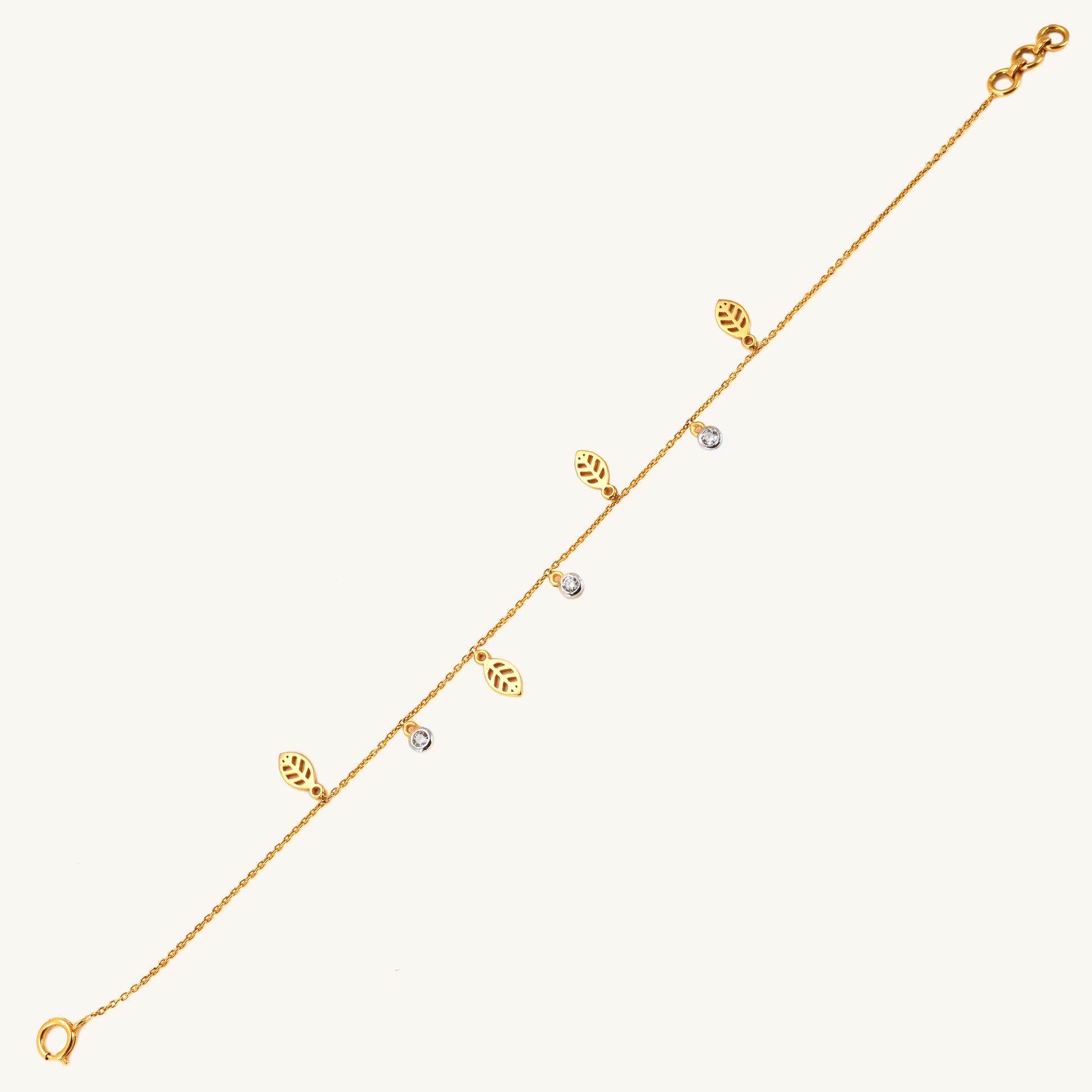 Caratly 18kt gold Leaf Diamond Bracelet featuring a delicate chain with alternating dangling open gold leaf charms and round diamond accents under Rs. 40,000