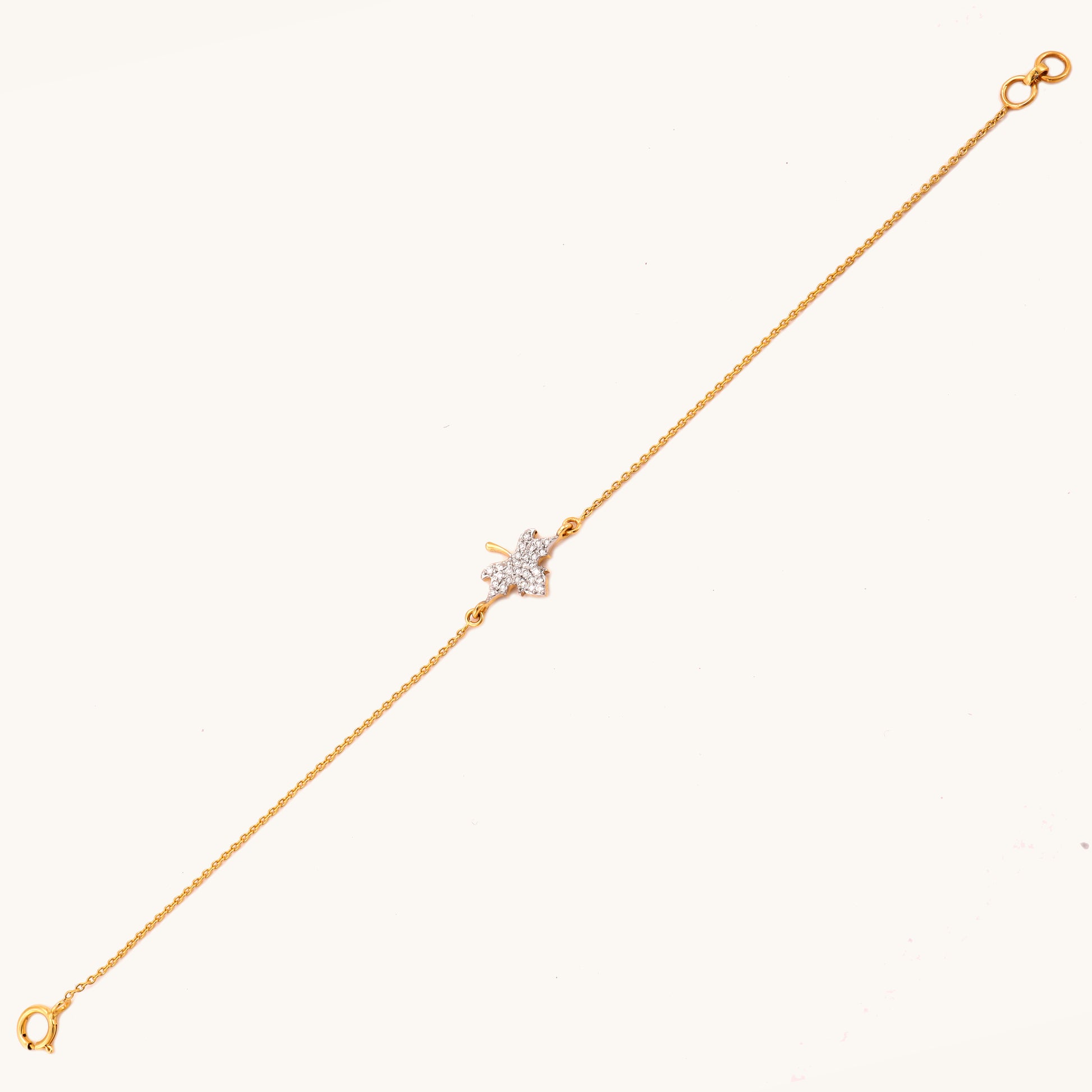 Caratly 18kt gold Maple Diamond Bracelet featuring a detailed maple leaf charm fully encrusted with pave diamonds. Minimal gift for her under Rs. 30,000