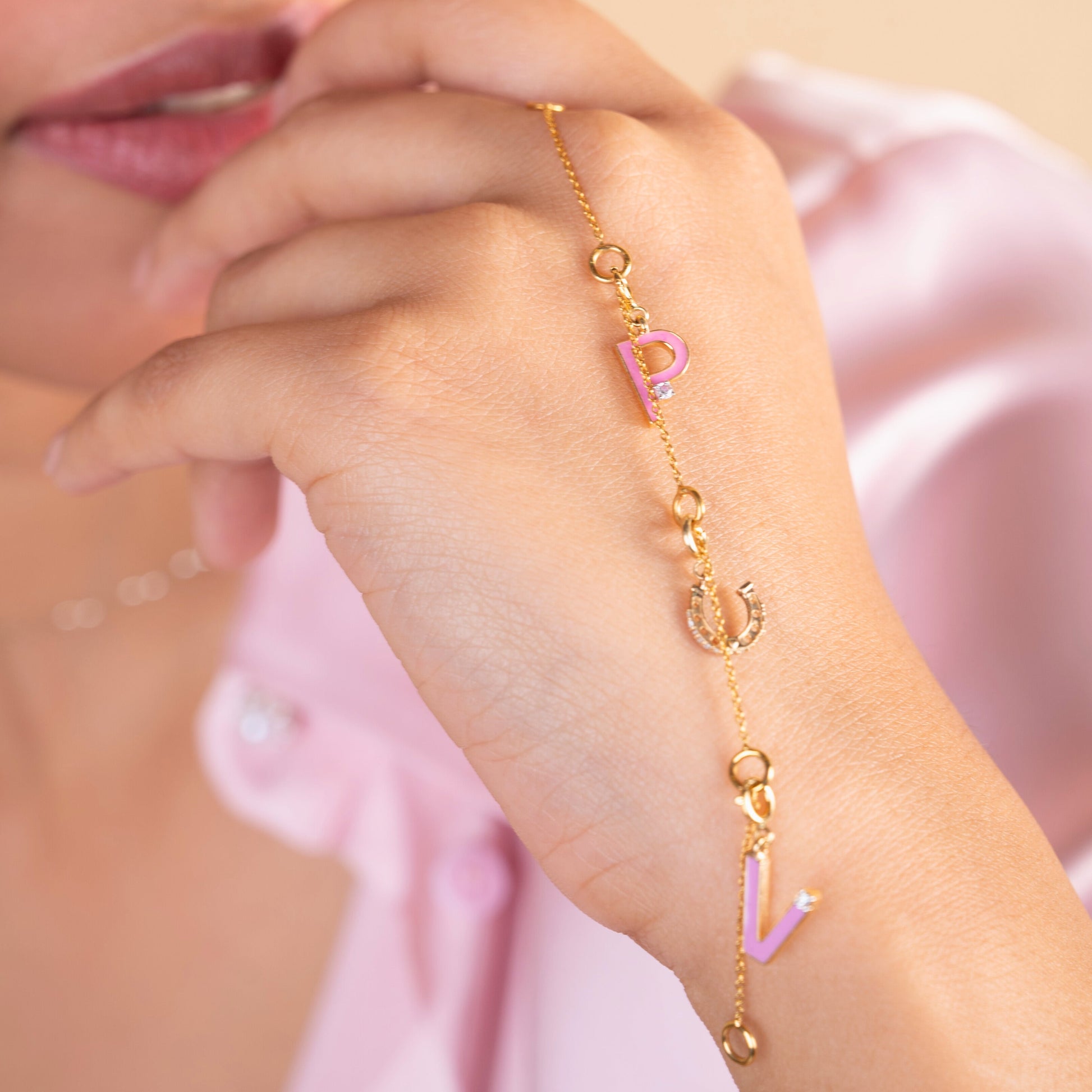 Caratly 18kt gold Charm Bracelet base chain featuring evenly spaced circular rings designed for clipping on personalized charms. Customizable gifts under Rs. 20,000