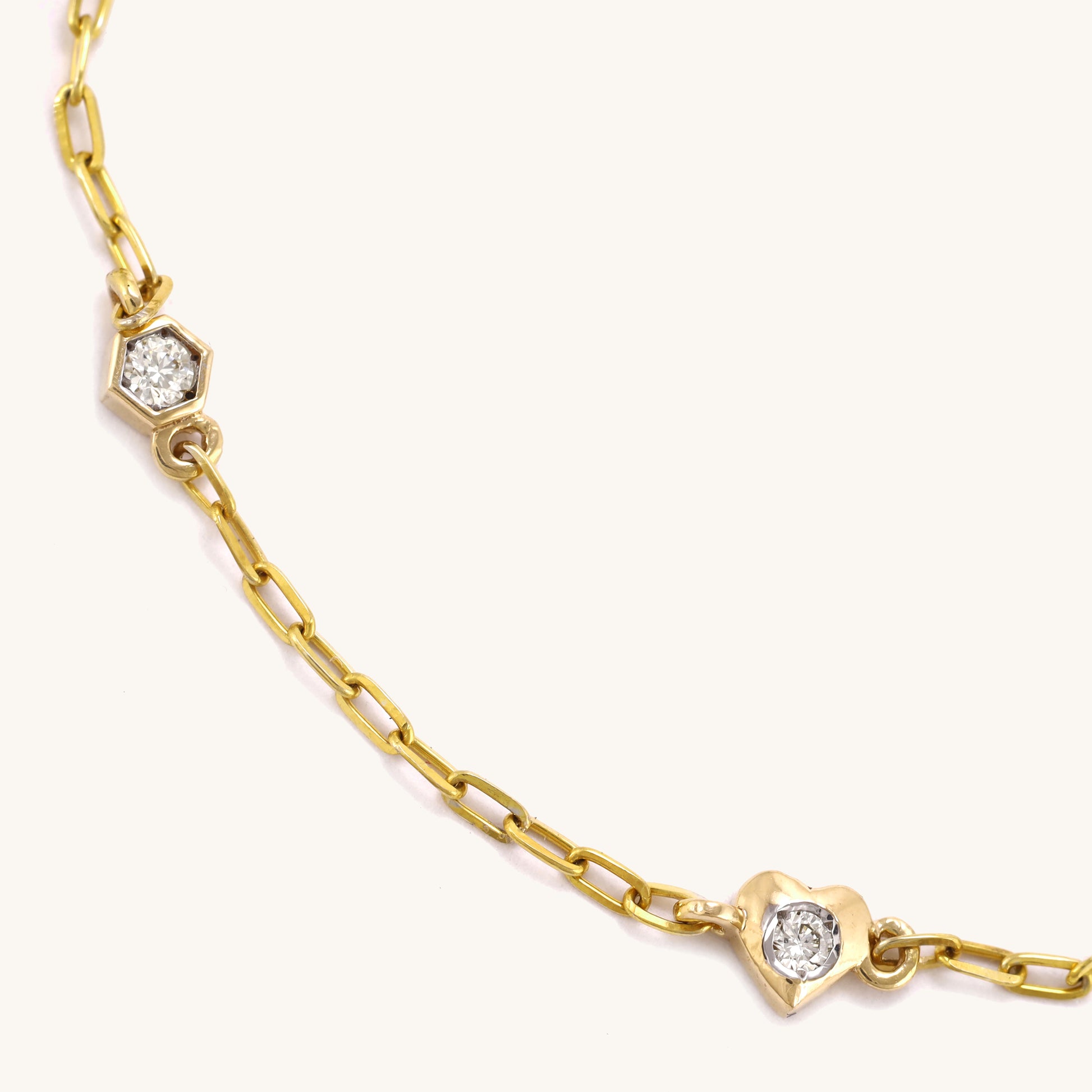 Caratly 18kt gold 4 Style Diamond Bracelet featuring a delicate chain with spaced diamond stations in various shapes including a heart and hexagon under Rs. 30,000