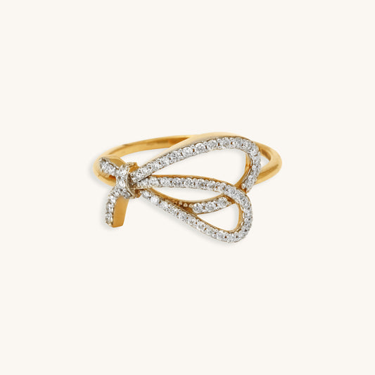 Caratly 18kt gold Bow Diamond Ring featuring an open, asymmetrical ribbon or bow shape fully outlined in pave diamonds 