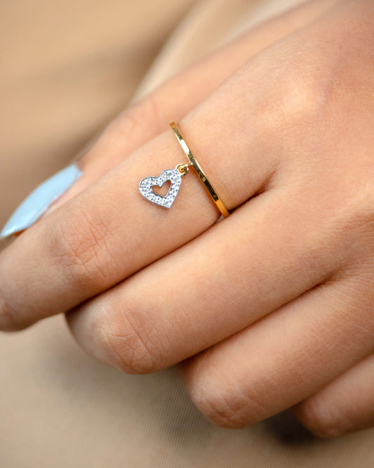 Caratly 18kt gold Dangling Heart Ring with 0.07ct pave diamond heart charm hanging from a thin band under rs. 30,000