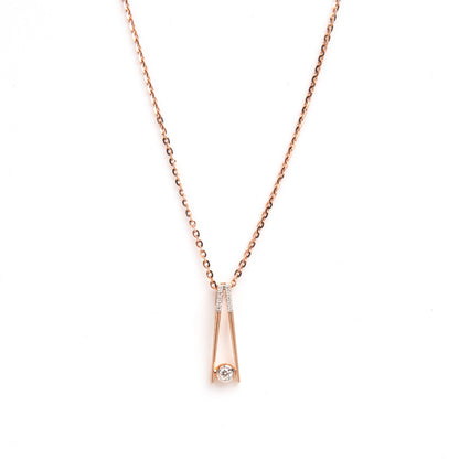 Caratly 18kt gold Elegant Diamond Pendant with 0.10ct solitaire diamond in a modern V-shape drop setting. Minimalist gift ideas for her under 40,000