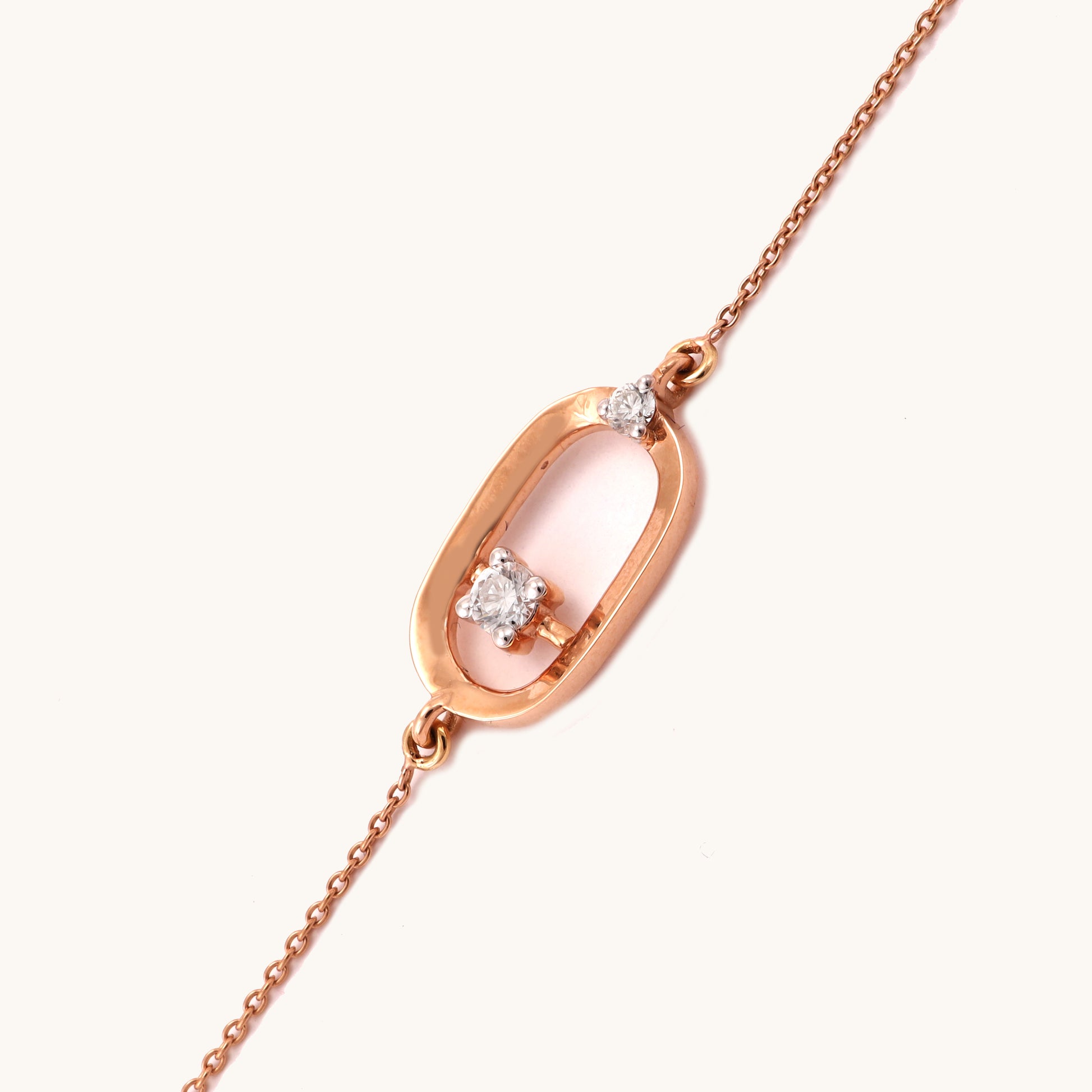 Caratly 18kt gold Encircle Diamond Bracelet featuring an elongated open oval link with a single floating diamond in the center and side accents. Best everyday jewellery gift for her under Rs. 45,000
