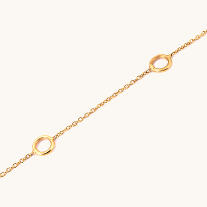 Caratly 18kt gold Charm Bracelet base chain featuring evenly spaced circular rings designed for clipping on personalized charms. Customizable gifts under Rs. 20,000