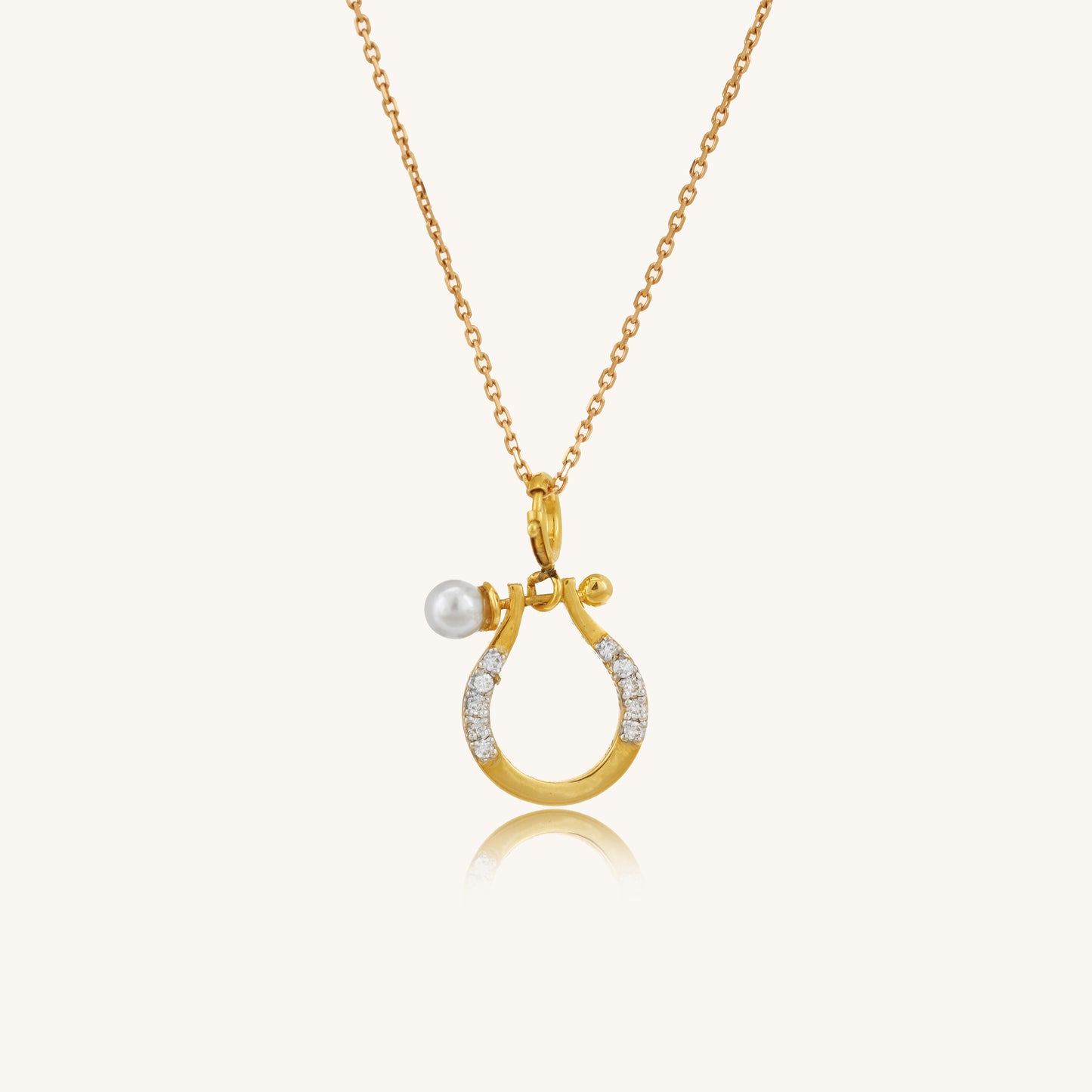 Caratly 18kt gold Horse shoe Pendant featuring a small lucky horseshoe motif with pave diamonds and a single pearl accent. Perfect gift for her under Rs. 20,000