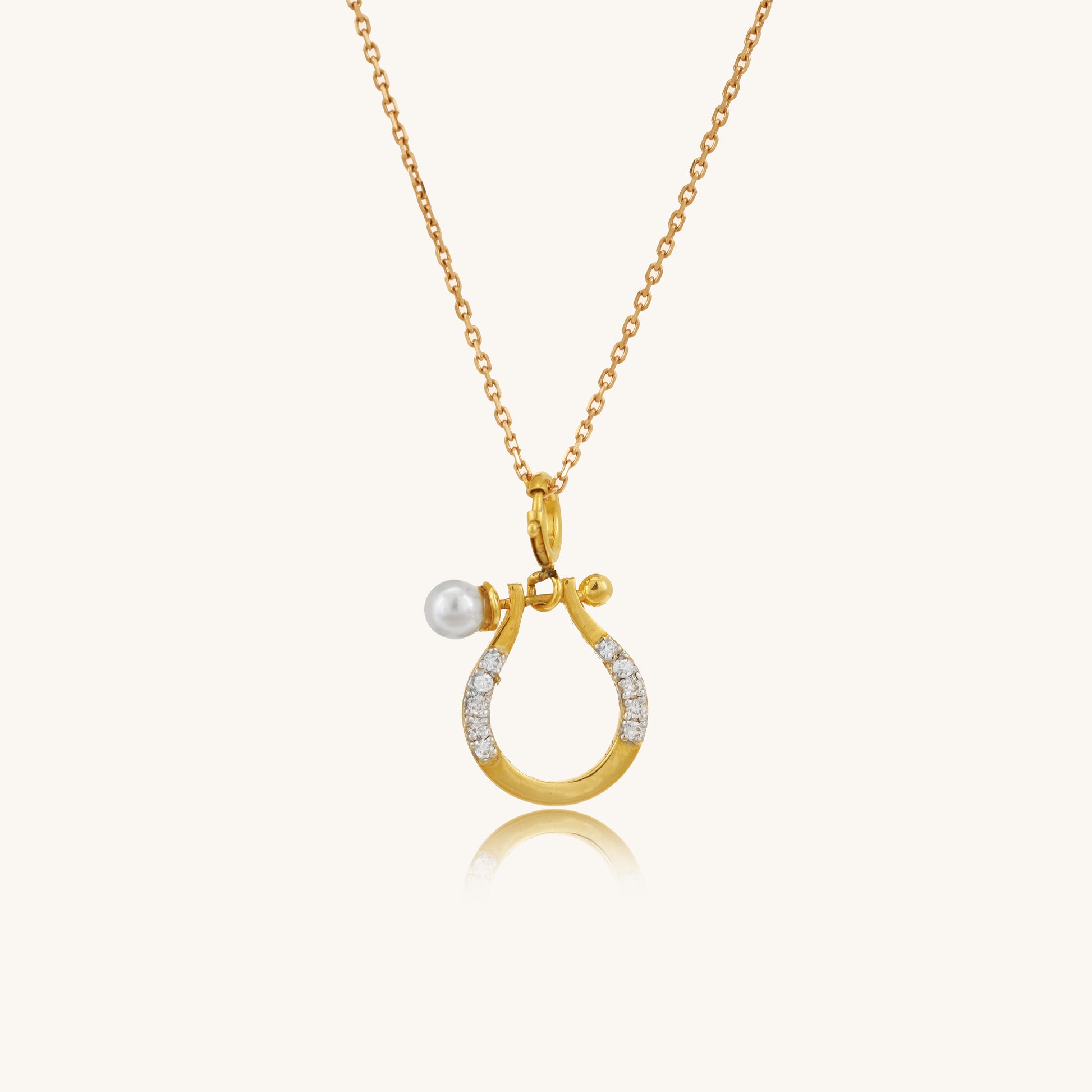 Caratly 18kt gold Horse shoe Pendant featuring a small lucky horseshoe motif with pave diamonds and a single pearl accent. Perfect gift for her under Rs. 20,000