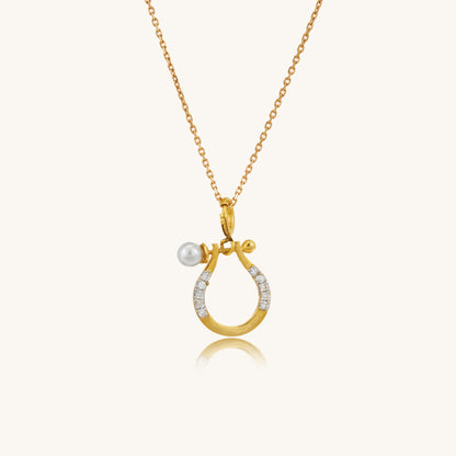 Caratly 18kt gold Horse shoe Pendant featuring a small lucky horseshoe motif with pave diamonds and a single pearl accent. Perfect gift for her under Rs. 20,000