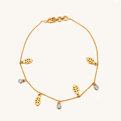 Caratly 18kt gold Leaf Diamond Bracelet featuring a delicate chain with alternating dangling open gold leaf charms and round diamond accents under Rs. 40,000