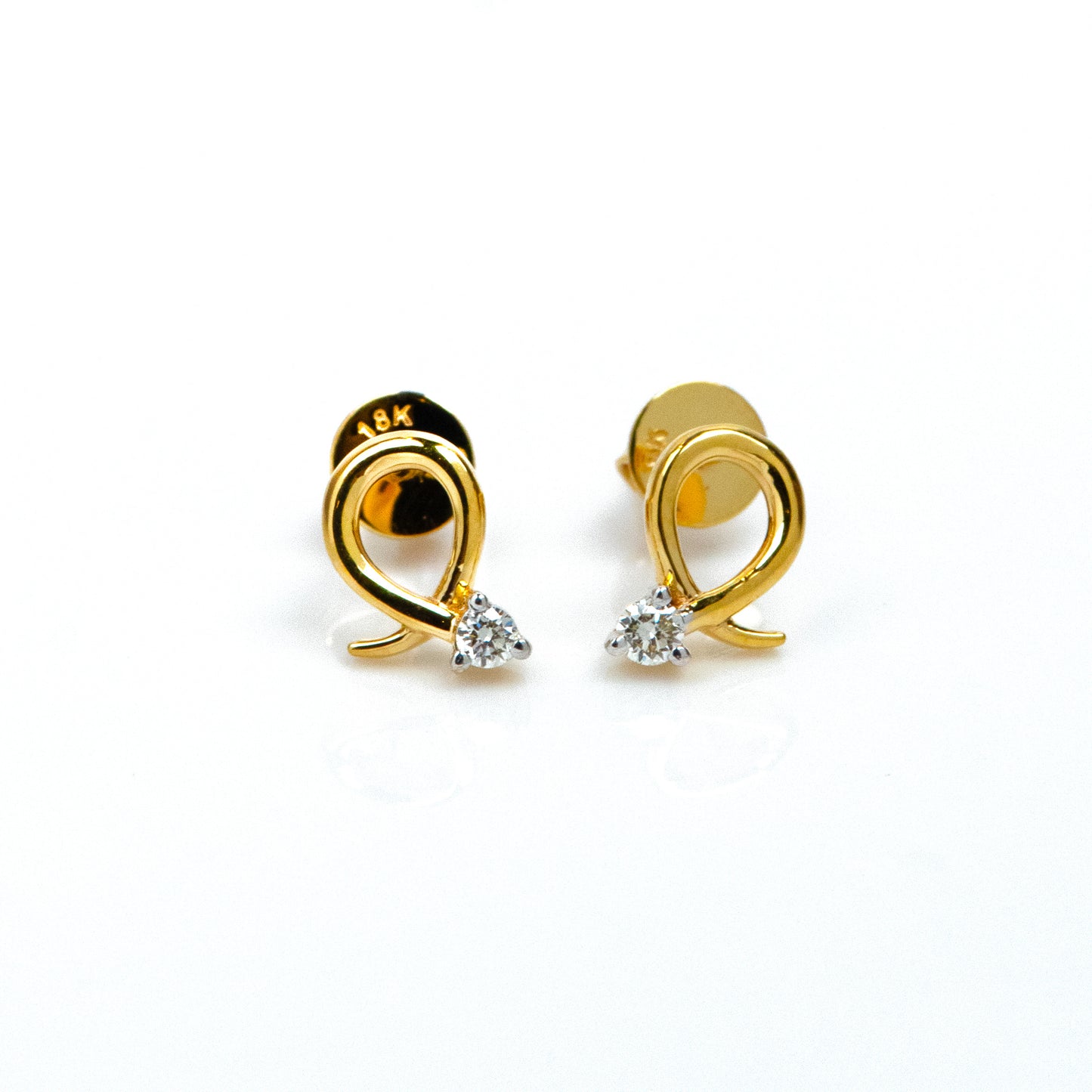 Caratly 18kt gold Loop Diamond Earring with 0.06ct diamond accent in a twisted gold wire loop design, minimal luxury gifts under Rs. 30,000