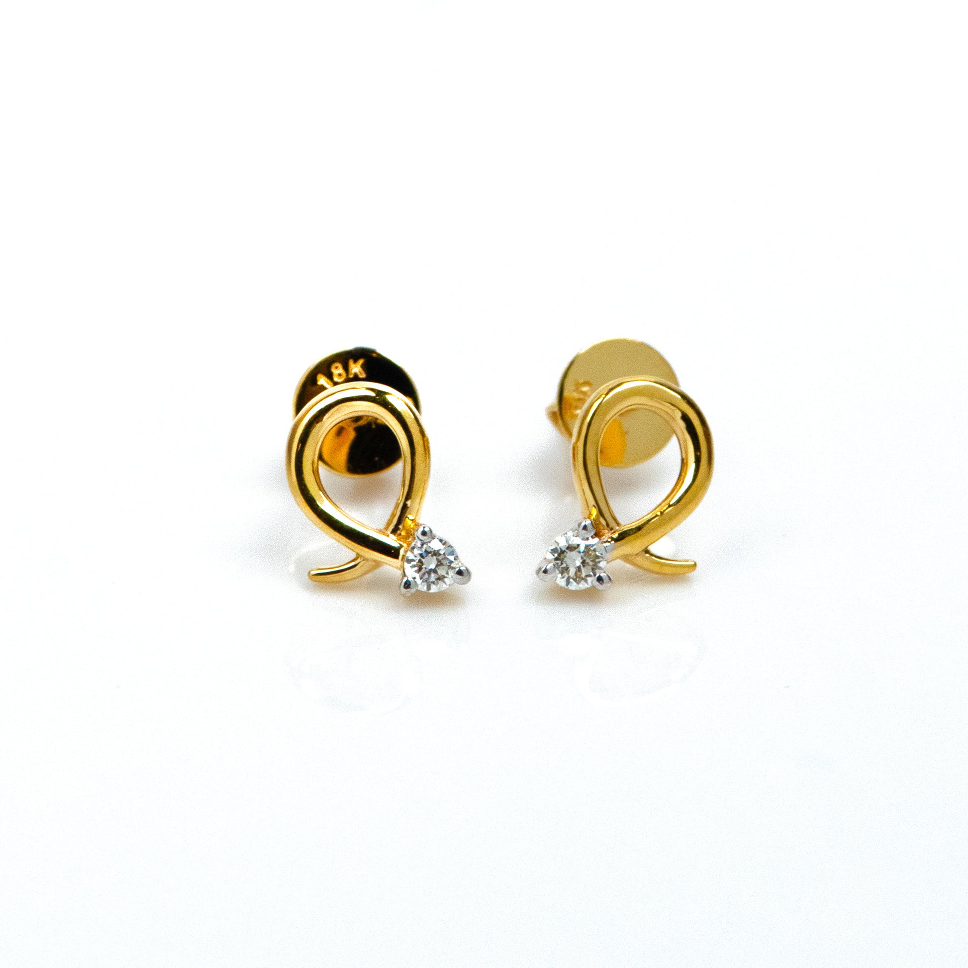 Caratly 18kt gold Loop Diamond Earring with 0.06ct diamond accent in a twisted gold wire loop design, minimal luxury gifts under Rs. 30,000