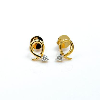 Caratly 18kt gold Loop Diamond Earring with 0.06ct diamond accent in a twisted gold wire loop design, minimal luxury gifts under Rs. 30,000